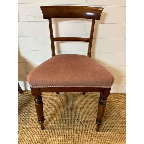 146 - Three mahogany dining chairs on turned front legs