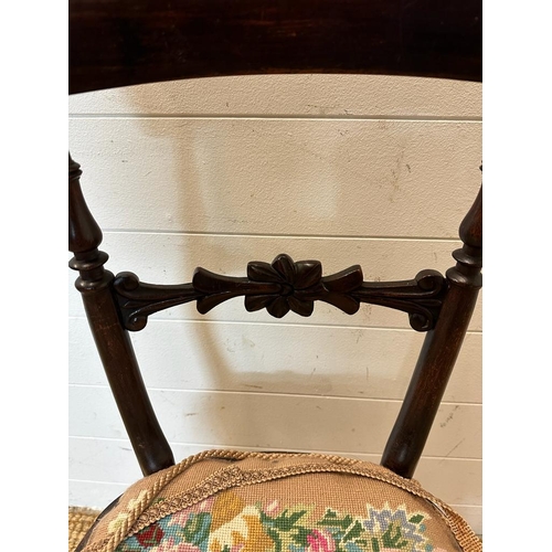 148 - A mahogany Victorian hall chair with carved mid rail on turned down swept legs AF