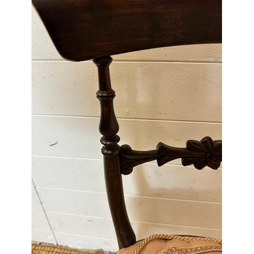 148 - A mahogany Victorian hall chair with carved mid rail on turned down swept legs AF