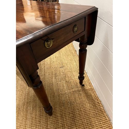 153 - A Pembroke table on turned legs (H69cm W91cm D49cm)