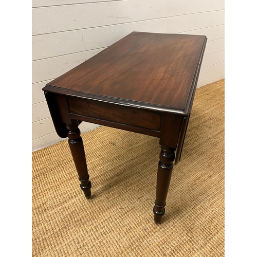 153 - A Pembroke table on turned legs (H69cm W91cm D49cm)