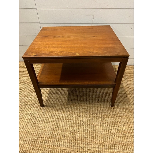 154 - A Mid Century teak side table on tapering legs and shelf under (H48cm W61cm D54cm)