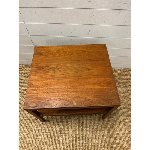 154 - A Mid Century teak side table on tapering legs and shelf under (H48cm W61cm D54cm)