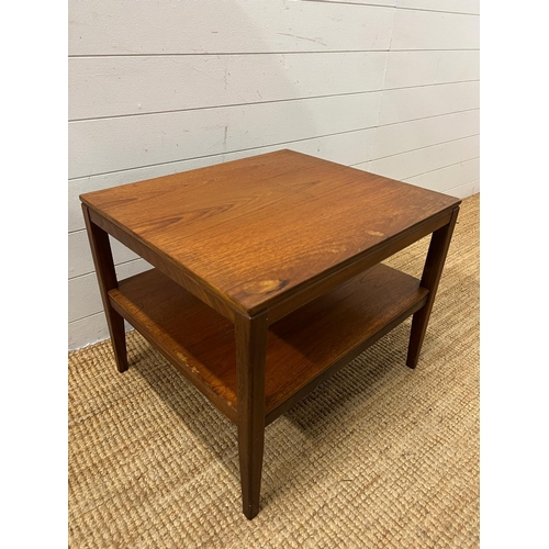 154 - A Mid Century teak side table on tapering legs and shelf under (H48cm W61cm D54cm)