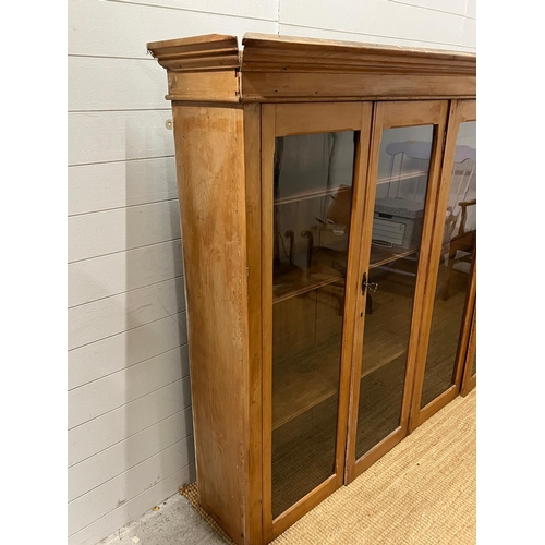 156 - A dresser display top or floor standing display, the glazed doors open to shelves (H150cm W195cm D37... 