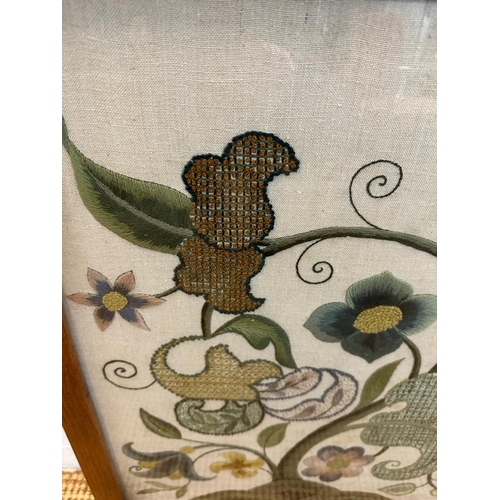 187 - A light oak framed fire screen with glazed front and floral tapestry insert