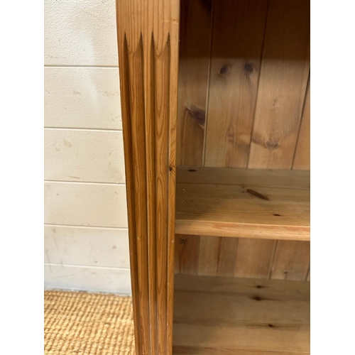 188 - A pine two shelf bookcase with fluted sides (H78cm W66cm D30cm)