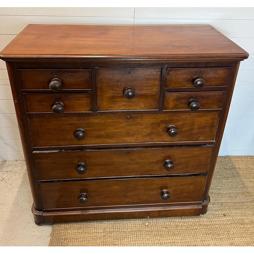 193 - A mahogany chest of drawers with four short and one centre drawer followed by three long (H120cm W12... 