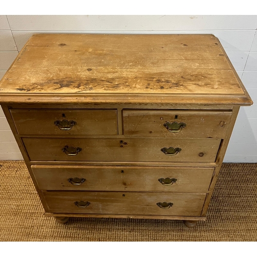 194 - Two over three pine chest of drawers with brass handles (H114cm W98cm D50cm)