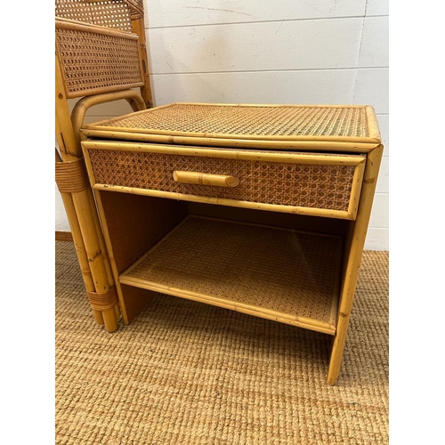 196 - A bamboo and rattan two drawer dressing table with mirror and a matching bedside table (H94cm W97cm ... 