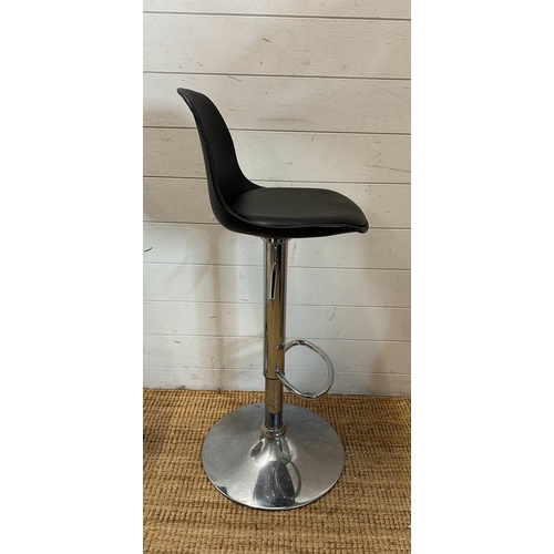 203 - A pair of chrome based faux black leather bar stools