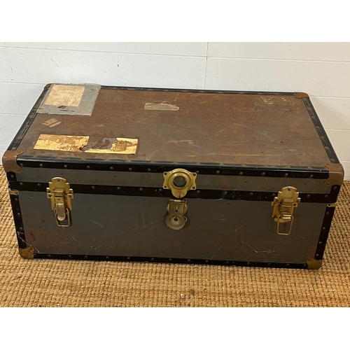 213 - A travel trunk with brass locks (H37cm W94cm D51cm)