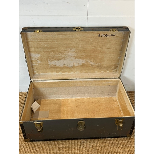 213 - A travel trunk with brass locks (H37cm W94cm D51cm)