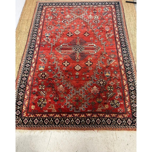 220 - A red ground Keshan Shirvaz style rug 210cm x 148cm