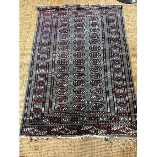 222 - A blue ground wool rug with geometric red and white boarder and geometric central pattern