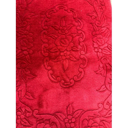 229 - A red ground rug or prayer mat with floral inlay 170x71