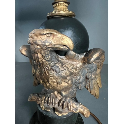 232 - An Eagle table lamp with a cast eagle sculpture to side on a marble base