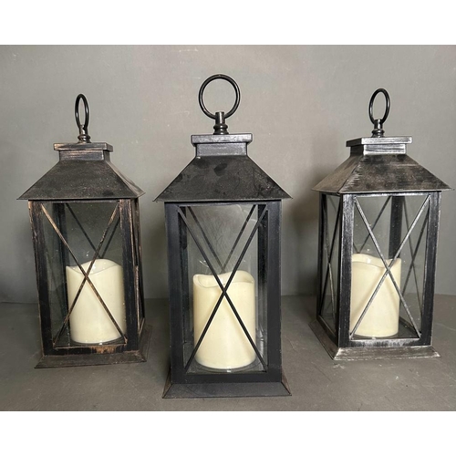 236 - Three black glazed hanging lanterns