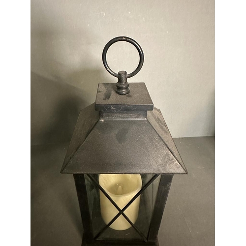 236 - Three black glazed hanging lanterns