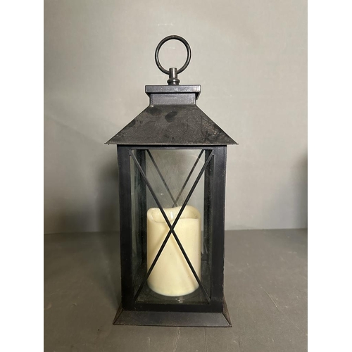 236 - Three black glazed hanging lanterns