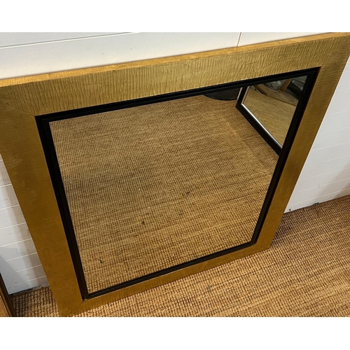 245 - A large mirror with black/gold frame 107 x 130cm