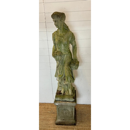 256 - A cast stone statue of a maiden holding basket of fruit on a square base