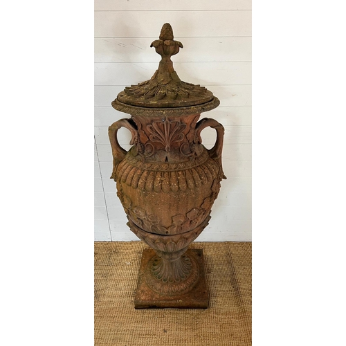 259 - A terracotta stone garden urn of amphora form and scrolling handles (H160cm W66cm)