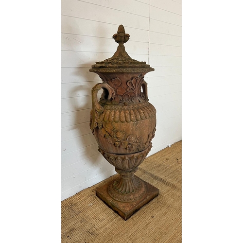 259 - A terracotta stone garden urn of amphora form and scrolling handles (H160cm W66cm)