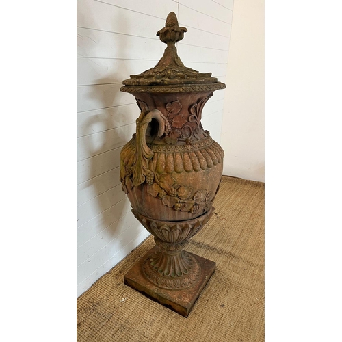 259 - A terracotta stone garden urn of amphora form and scrolling handles (H160cm W66cm)