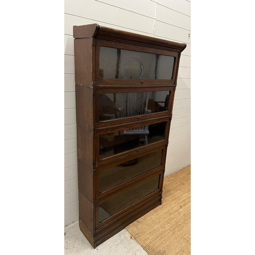 26 - A five tier Casler oak and glazed,barristers bookcase (H166cm W87cm D30cm)