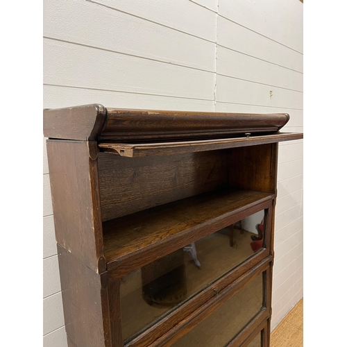 26 - A five tier Casler oak and glazed,barristers bookcase (H166cm W87cm D30cm)