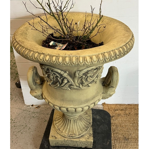 263 - A garden urn planter with scrolling leaves and handles to side on a fluted stem to base (H82cm Dia63... 