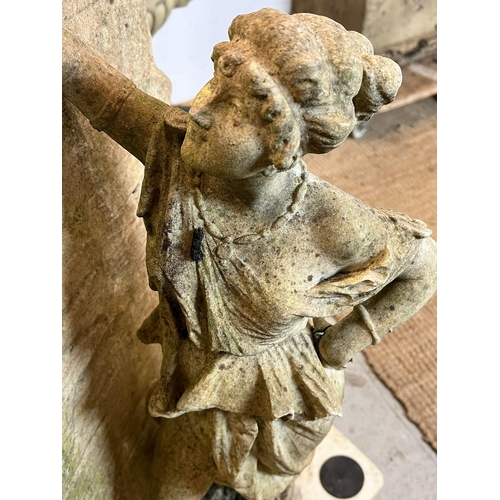 264 - A garden sculpture of a maiden leaning against a wall (H80cm W42cm)