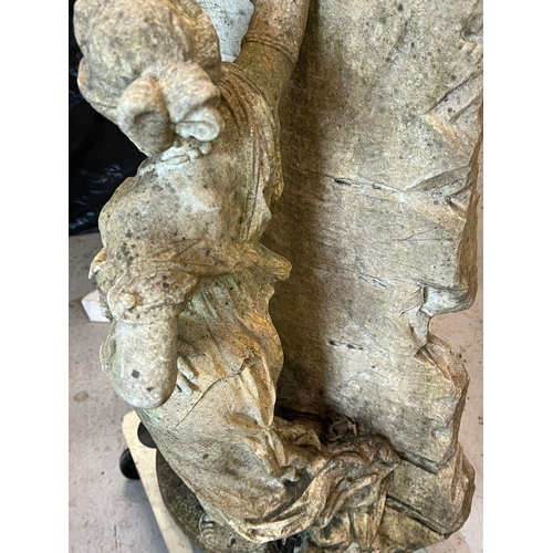 264 - A garden sculpture of a maiden leaning against a wall (H80cm W42cm)