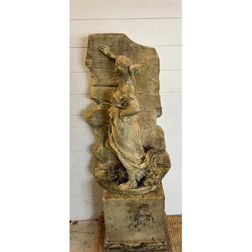 264 - A garden sculpture of a maiden leaning against a wall (H80cm W42cm)