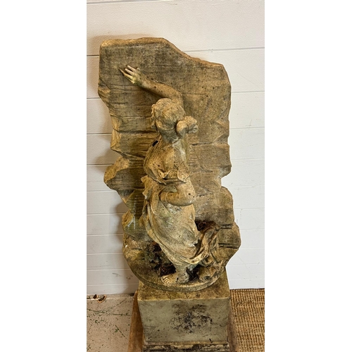 264 - A garden sculpture of a maiden leaning against a wall (H80cm W42cm)