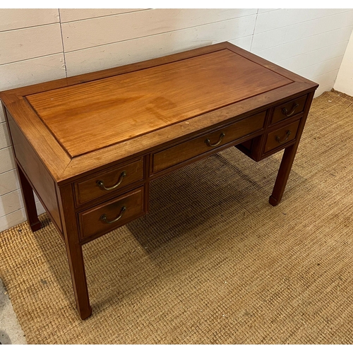 28 - Hardwood desk with one long drawer to centre and two short each side (H76cm W124cm D60cm)