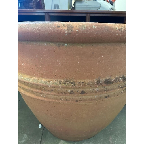 284 - A pair of large terracotta garden planters with ribbed centres (H80cm Dia90cm)