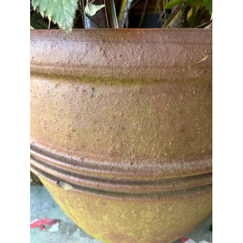 285 - A large terracotta garden planter with ribbed middle (H67cm Dia70cm)