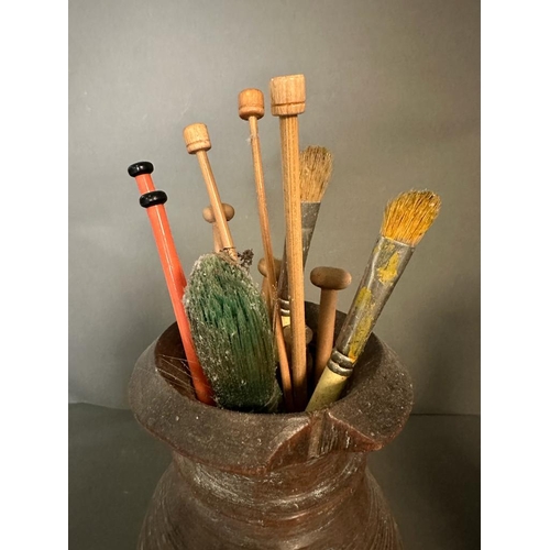 310 - Three wooden pots containing a selection of vintage paint brushes