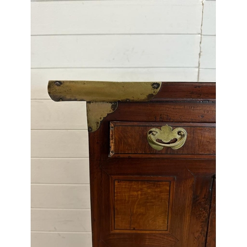 32 - A Korean two toned cabinet comprising of two cupboards with four drawers over, brass hinges, handles... 