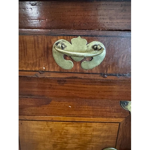 32 - A Korean two toned cabinet comprising of two cupboards with four drawers over, brass hinges, handles... 