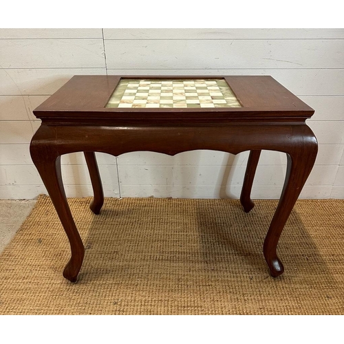 34 - A mahogany chess table with green and white marble board on cabriole legs (H75cm W87cm D50cm)