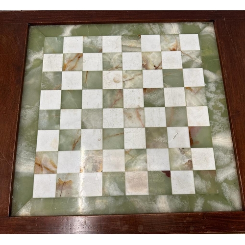 34 - A mahogany chess table with green and white marble board on cabriole legs (H75cm W87cm D50cm)