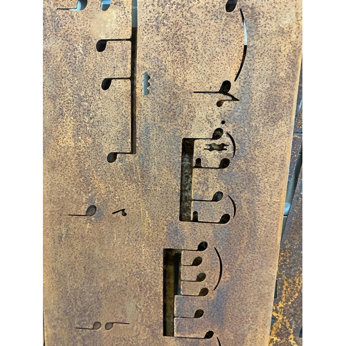 359 - Seventeen reclaimed metal sheets pierced with musical notes, various sizes