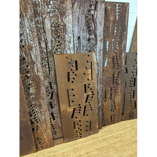 359 - Seventeen reclaimed metal sheets pierced with musical notes, various sizes