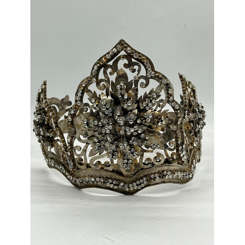 363 - A Malay Style Wedding crown, The Crown of metal set with faceted glass along with a metal flower box... 