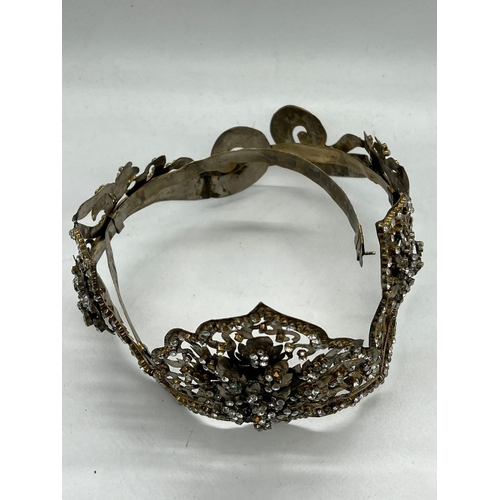 363 - A Malay Style Wedding crown, The Crown of metal set with faceted glass along with a metal flower box... 