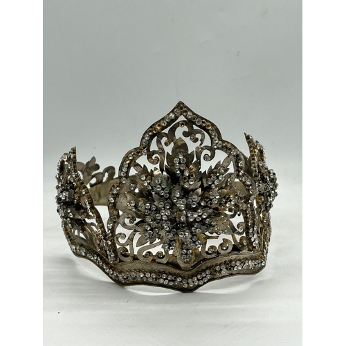 363 - A Malay Style Wedding crown, The Crown of metal set with faceted glass along with a metal flower box... 