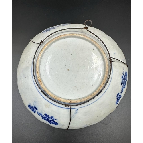 382 - Two Imari dishes with crimped rims and floral central motif